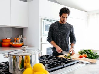 man cutting vegetables