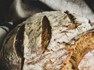 brown bread on white and black textile