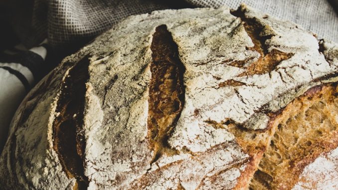 brown bread on white and black textile