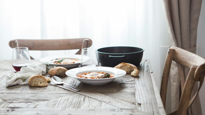 two white ceramic plates on brown wooden table