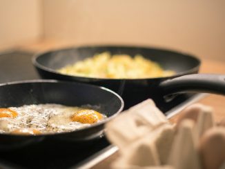 black ceramic bowl with yellow rice