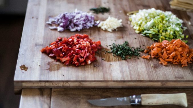 sliced vegetables on brown wooden chopping board