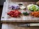 sliced vegetables on brown wooden chopping board