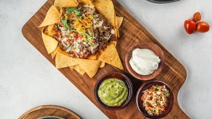 brown wooden chopping board with vegetable salad