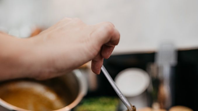 Photo by Vitor Monthay person holding silver spoon and brown meat